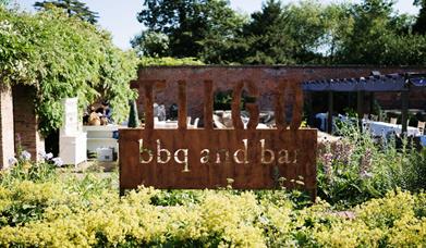 TIIGO BBQ sign in garden