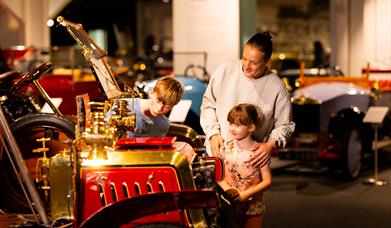 A family exploring around Haynes Motor Museum