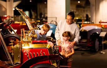 A family exploring around Haynes Motor Museum