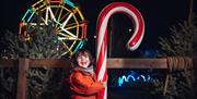 Child and giant candy cane