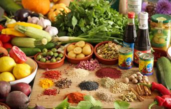 An image of various fruit, vegetables, sauces and spices