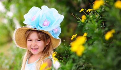 A young girl wearing an Easter bonnet 