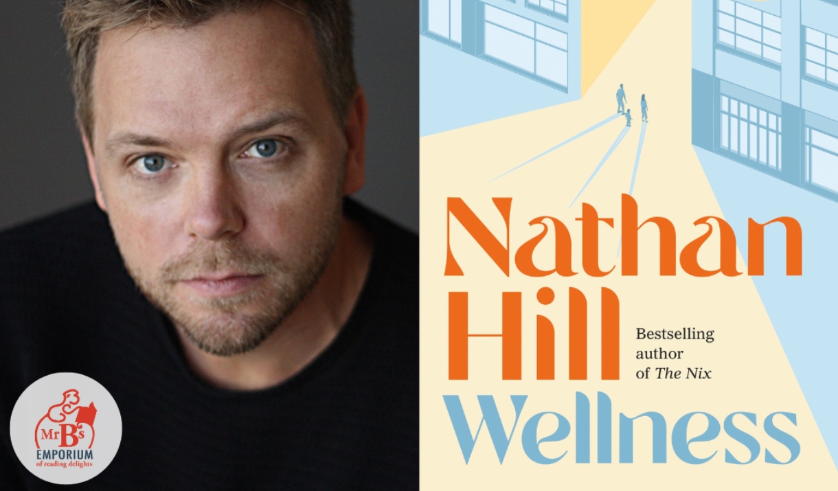 Author Nathan Hill with his book Wellness
