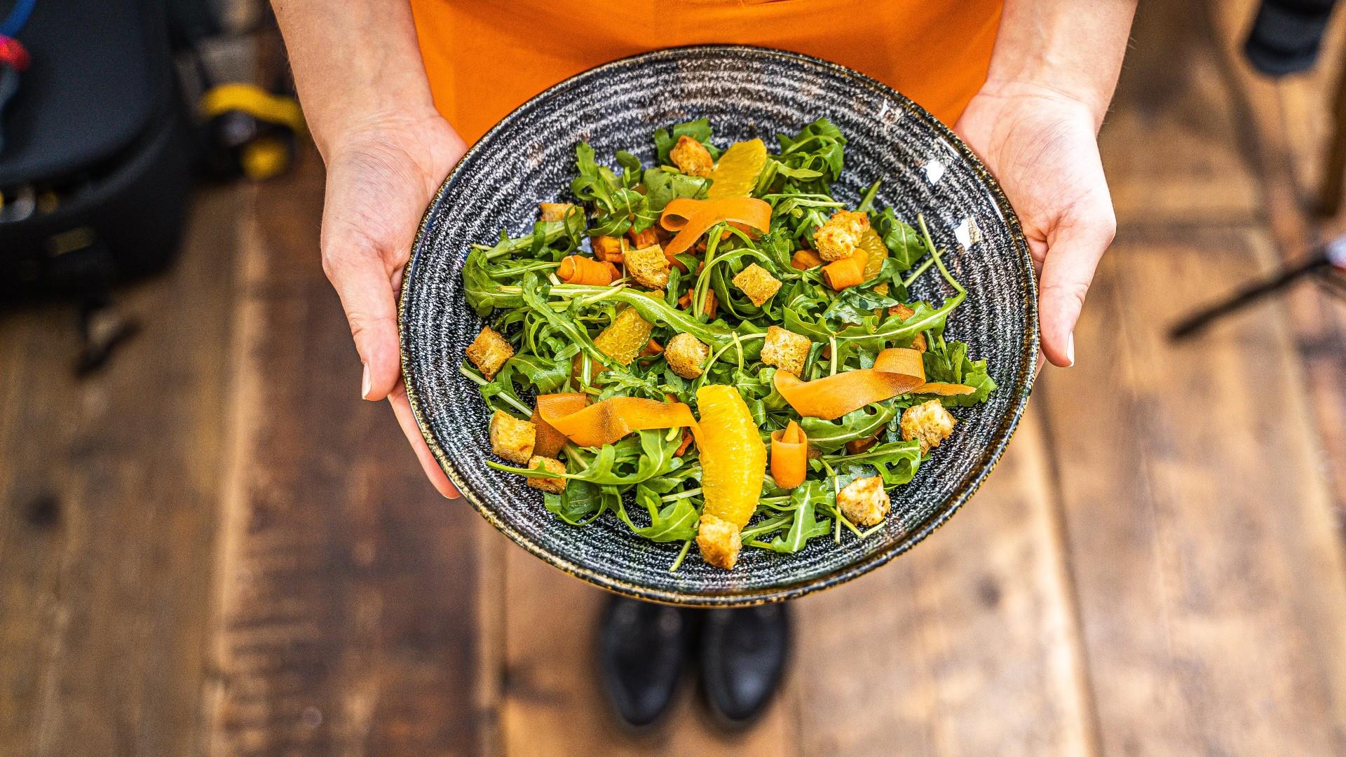 Abbey Hotel Holding Plate of Vegan food