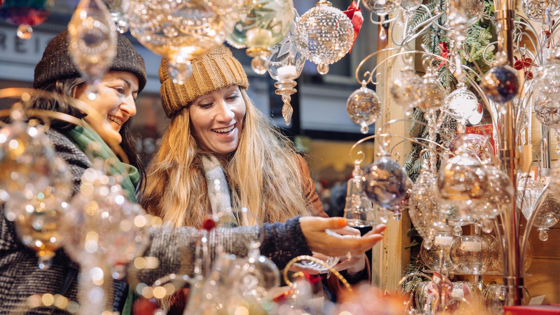Women browsing market stall