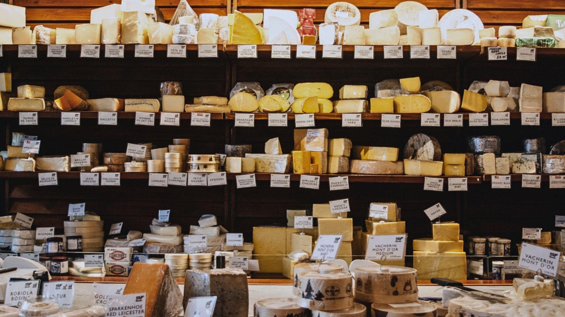 Shelves of cheese at The Fine Cheese Co in Bath