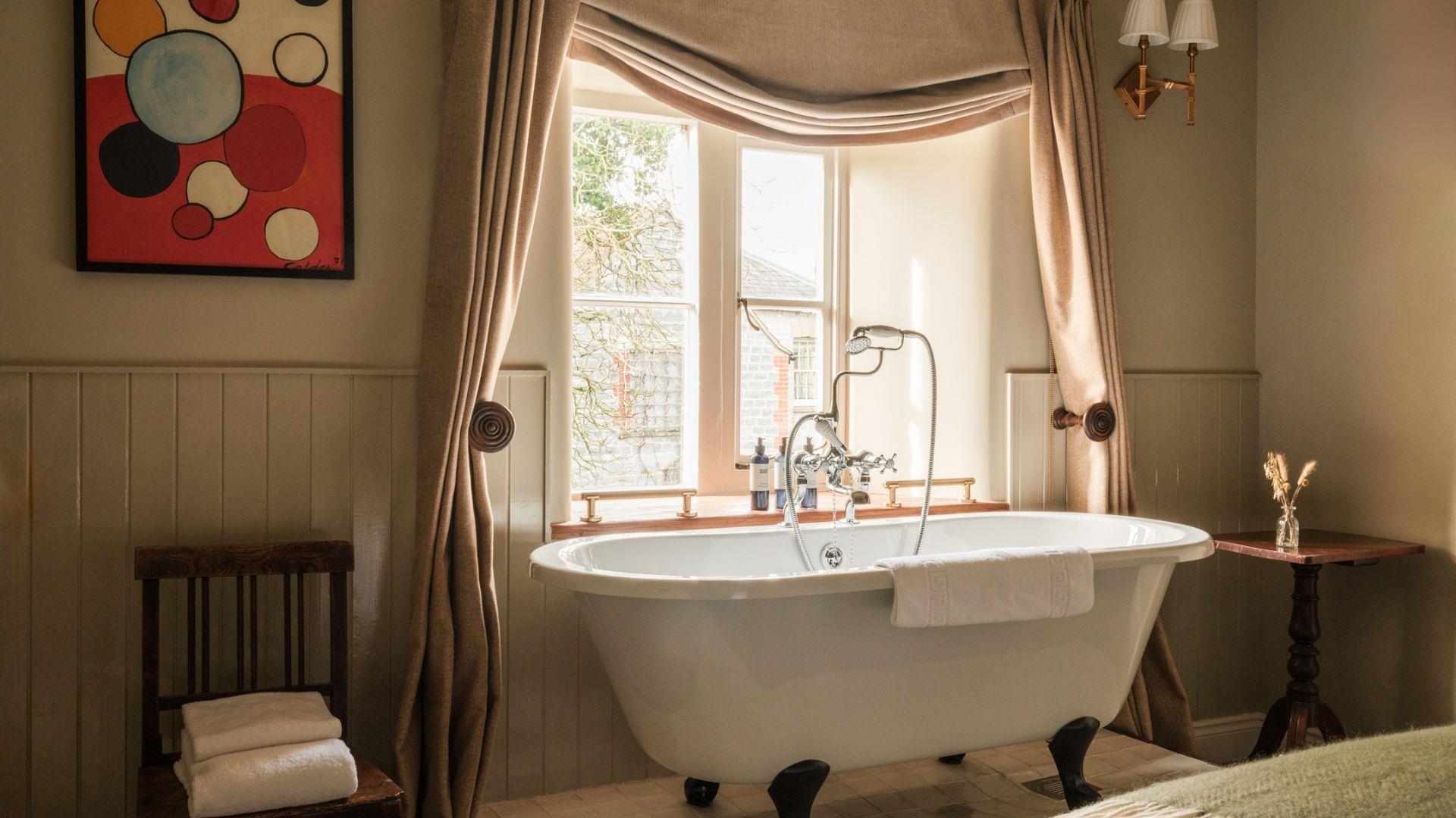 Rolltop bath in bedroom at The Manor House Inn