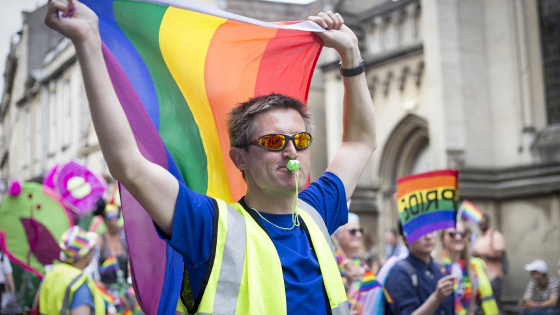 Man at Pride with High Vis