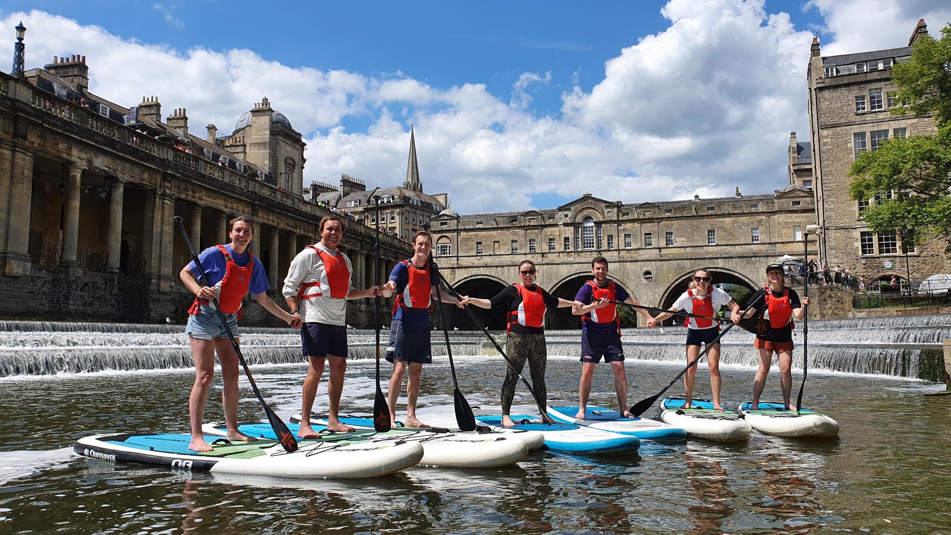 people on paddleboards