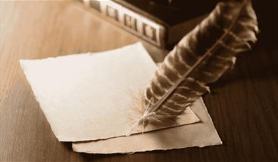 Writing quill and paper