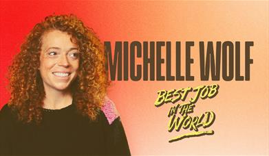 Smiling curly-haired person on an orange background with text "Michelle Wolf - Best Job in the World."
