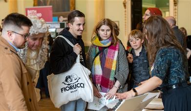 A group of people at the annual World Heritage Day event in Bath's Guildhall 