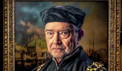 Sir Thomas More stands in front of a painting of that era. 
