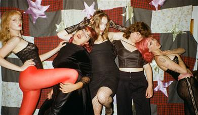 Five musicians posing