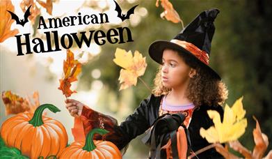 Girl in a witches costume having Halloween fun