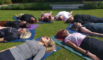 Women doing yoga stretches