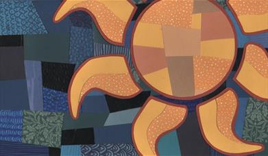 Abstract collage of an orange sun made from patterned paper on a blue patchwork background.