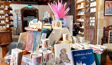 Bookmarks, pens, mugs, and books