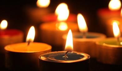 It's evening, a variety of candles are displayed. 
