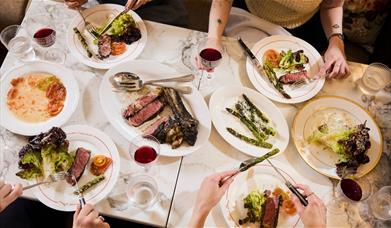 A table laden with food at the Emberwood brasserie in central Bath 