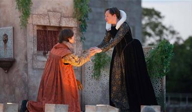 Outdoor theatre show with two actors on stage