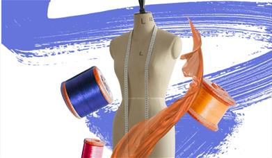 A tailors dummy/mannequin surrounded by ribbon. 