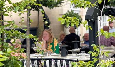 People sat in garden at hotel