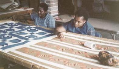 Women making quilts