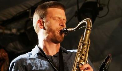 man playing saxophone