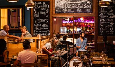 A band of musicians performing in the restaurant at Green Park Brasserie, Bath