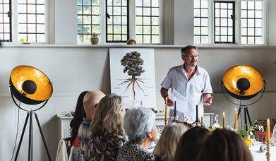 Nutritionist providing a talk over lunch.