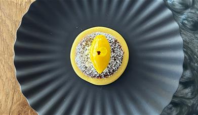 A dish on a round circular plate.