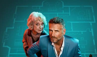 The cast of Murder at Midnight (Jason Durr, Susie Blake),  in front of a blue blueprint of a large house.  