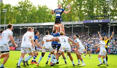 a man being lifted up in rugby