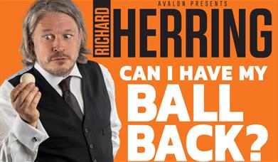 Richard Herring holding a ball