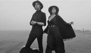 black and white photo of two cowboys