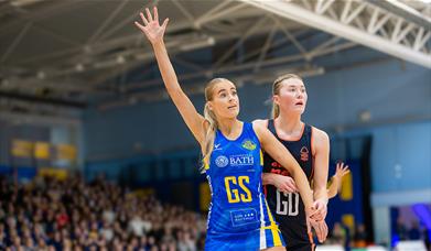 Team Bath Netball player Katherine Mansfield signals for a pass while under pressure from a Nottingham Forest defender