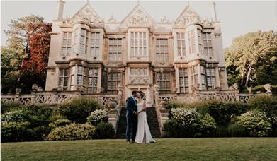 The married couple in front of the Hall