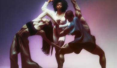 Three dancers forming a triangle shape