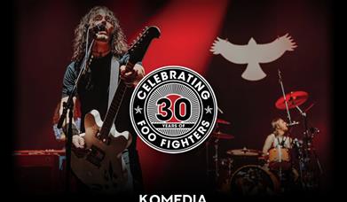 Promotional poster for a UK Foo Fighters concert at Komedia Bath on Friday 9 May 2025. The poster features a guitarist singing into a microphone with