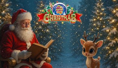 Santa Claus sits in a golden chair reading a book in a snowy, decorated forest, while a cute reindeer calf stands nearby. The Avon Valley Christmas lo