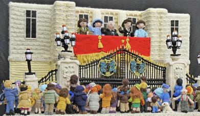 A knitted scene of the Royal Party on the balcony of Buckingham Palace, celebrating VE Day