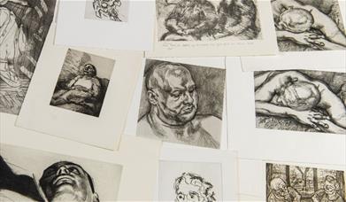 a selection of prints scattered on a table