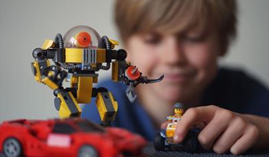 boy playing with lego