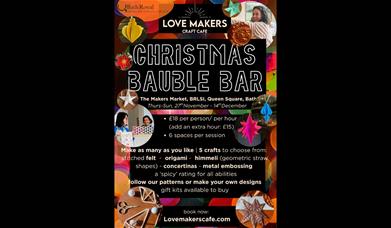 A poster advertising a 'bauble bar' by The Love Makers Craft Cafe at the BRLSI Christmas Makers' Market in Bath.
