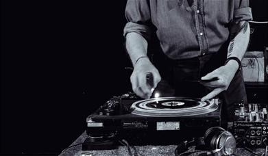 A black and white photo of Kev Stone