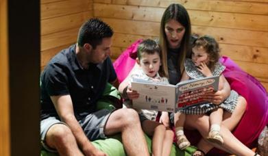 parents reading to their children