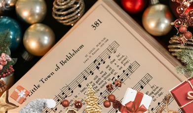 Christmas carol sheet with christmas decorations