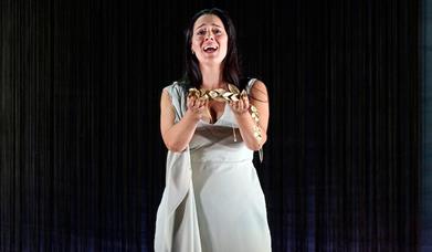 Woman holding necklace