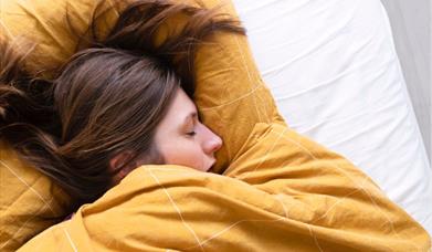 Woman sleeping in bed